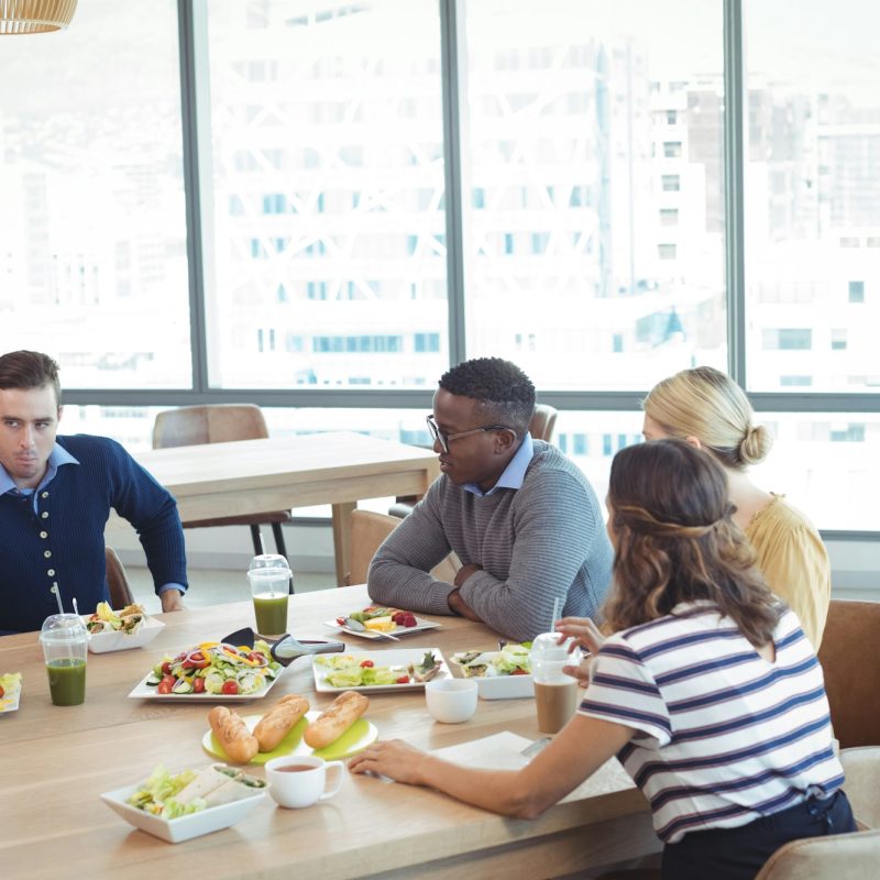 Business people having lunch at office cafeteria